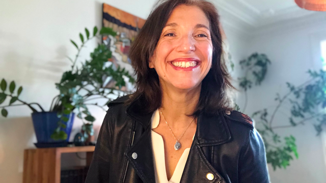 A person smiling for the camera

Description automatically generated with medium confidence